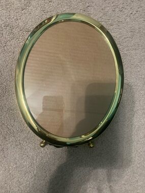 Oval polished brass picture frame. 8x10